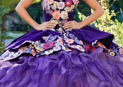Purple ruffled quinceañera ball gown with tiara at Hem & Her Bridal in Tucson, AZ