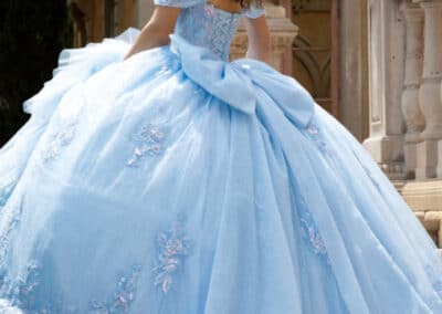 Powder blue tiered quinceañera ball gown at Hem & Her Bridal in Tucson, AZ