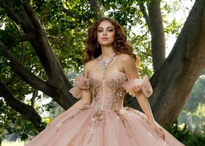 Rose-blush quinceañera ball gown outdoors at Hem & Her Bridal in Tucson, AZ